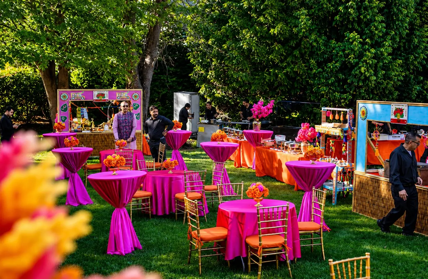 Colorful Chai Chenak catering booths at an outdoor event